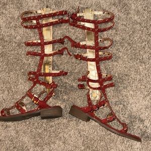 Red gladiator sandals with gold buttons, size youth three